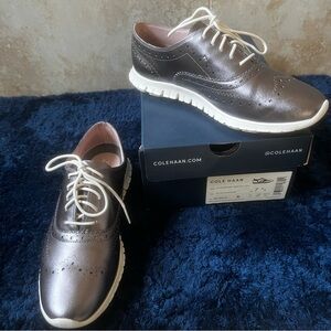 Super comfy Cole Haan sneakers in a stylish metallic leather